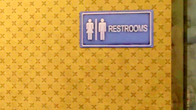 Ellie at the Gloryhole sucking a dick and getting a creampie